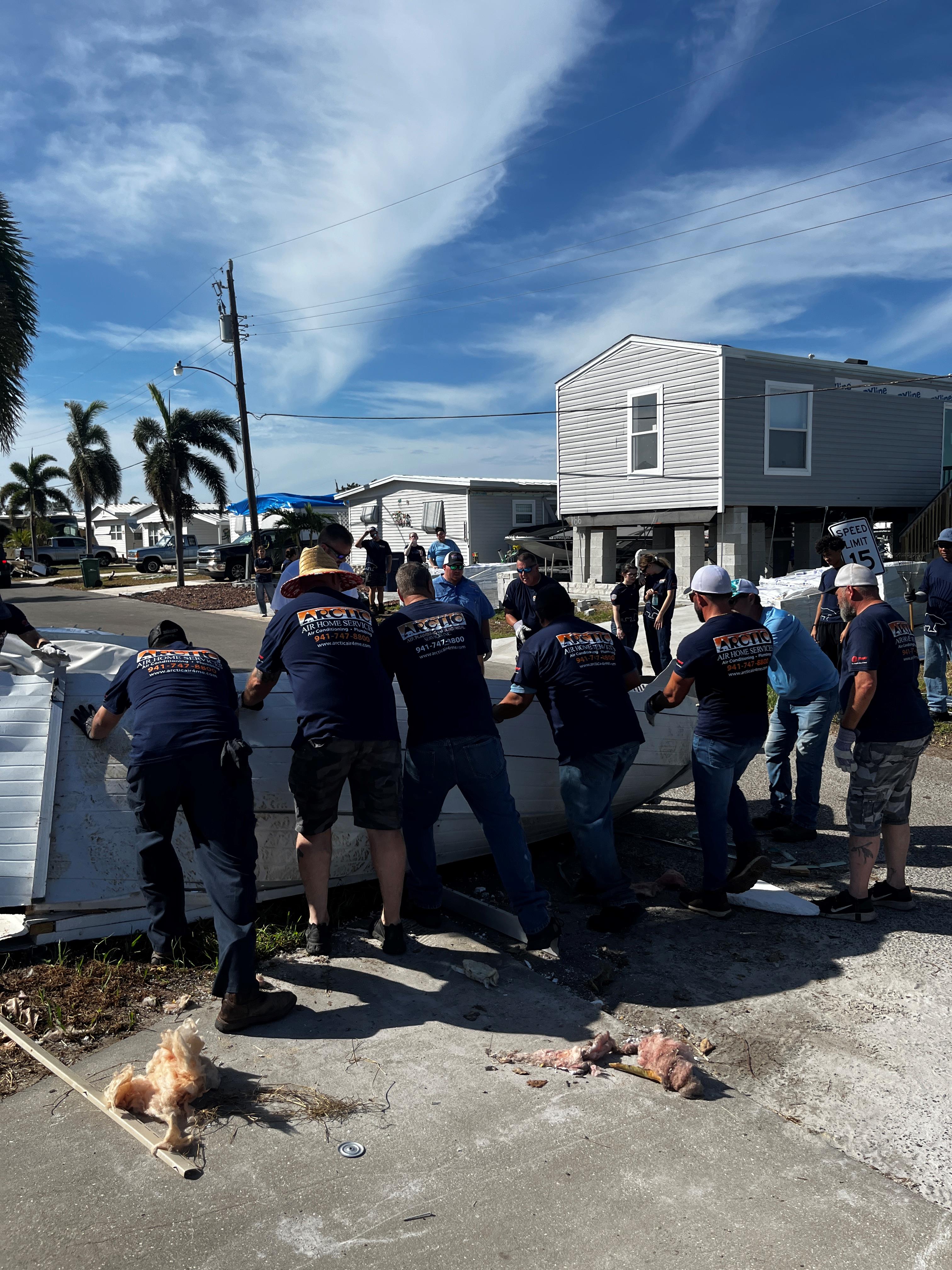 team cleaning up after storm