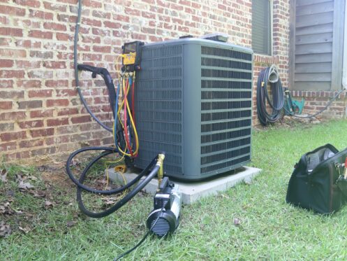Air conditioner being serviced