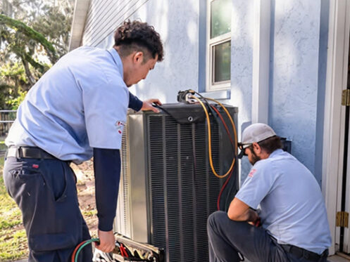 Arctic Air technicians performing AC maintenance